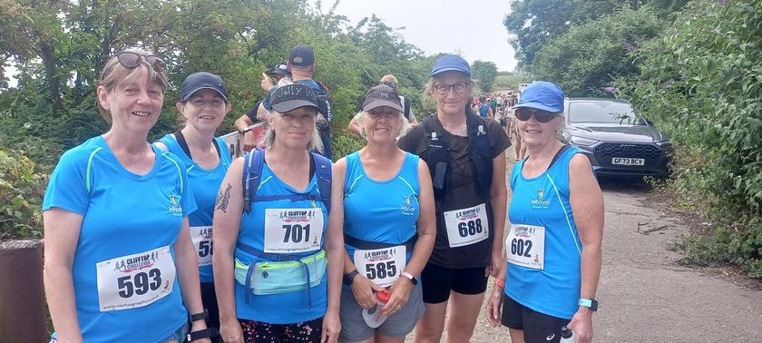 Six Jelly Legs members with their race numbers at the start of the Clifftop Challenge