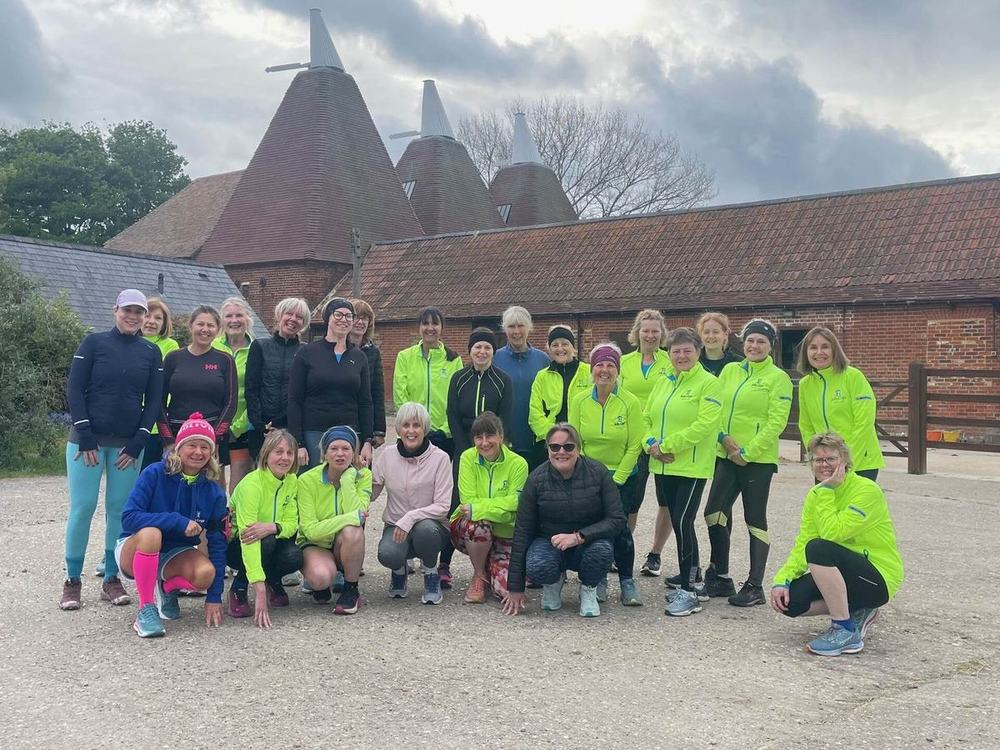 Jelly Legs members gathered in front of Kentish oast houses