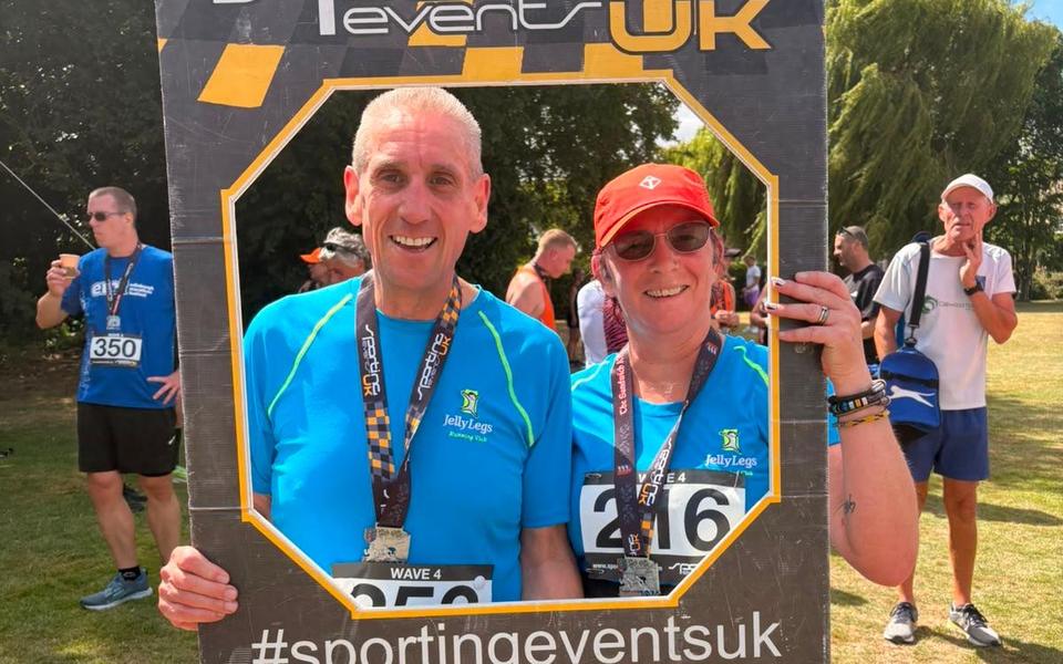 Two Jelly Legs members with their medals at a Sporting Events UK race